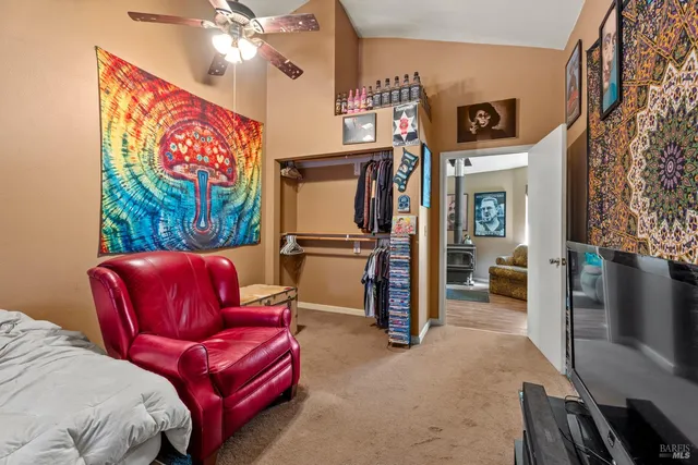 a view of a livingroom with furniture and a flat screen tv