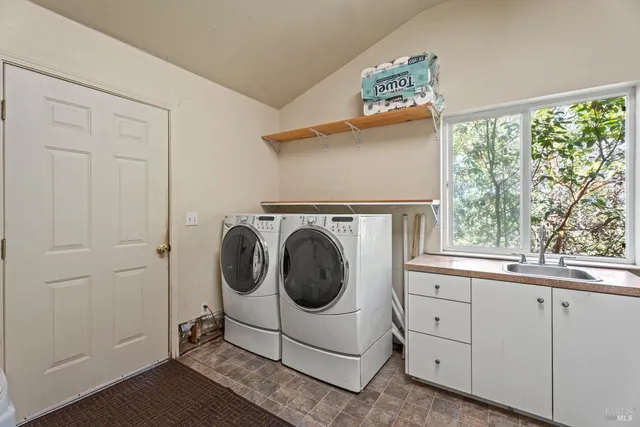 a utility room with dryer and washer