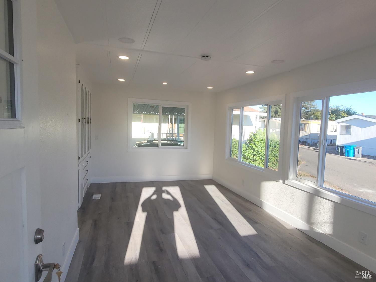 839 Nonie Street Santa Rosa, CA 95403 - Photo 4 of 23 a view of wooden floor and windows in a room