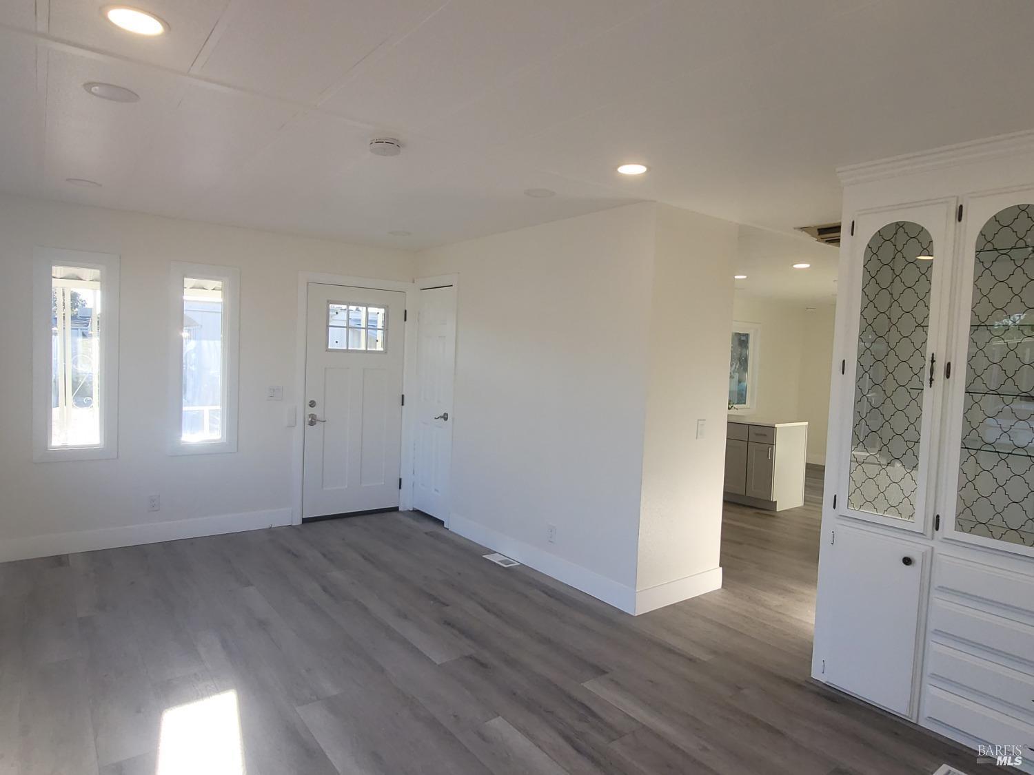 839 Nonie Street Santa Rosa, CA 95403 - Photo 5 of 23 a view of an empty room with wooden floor and a window