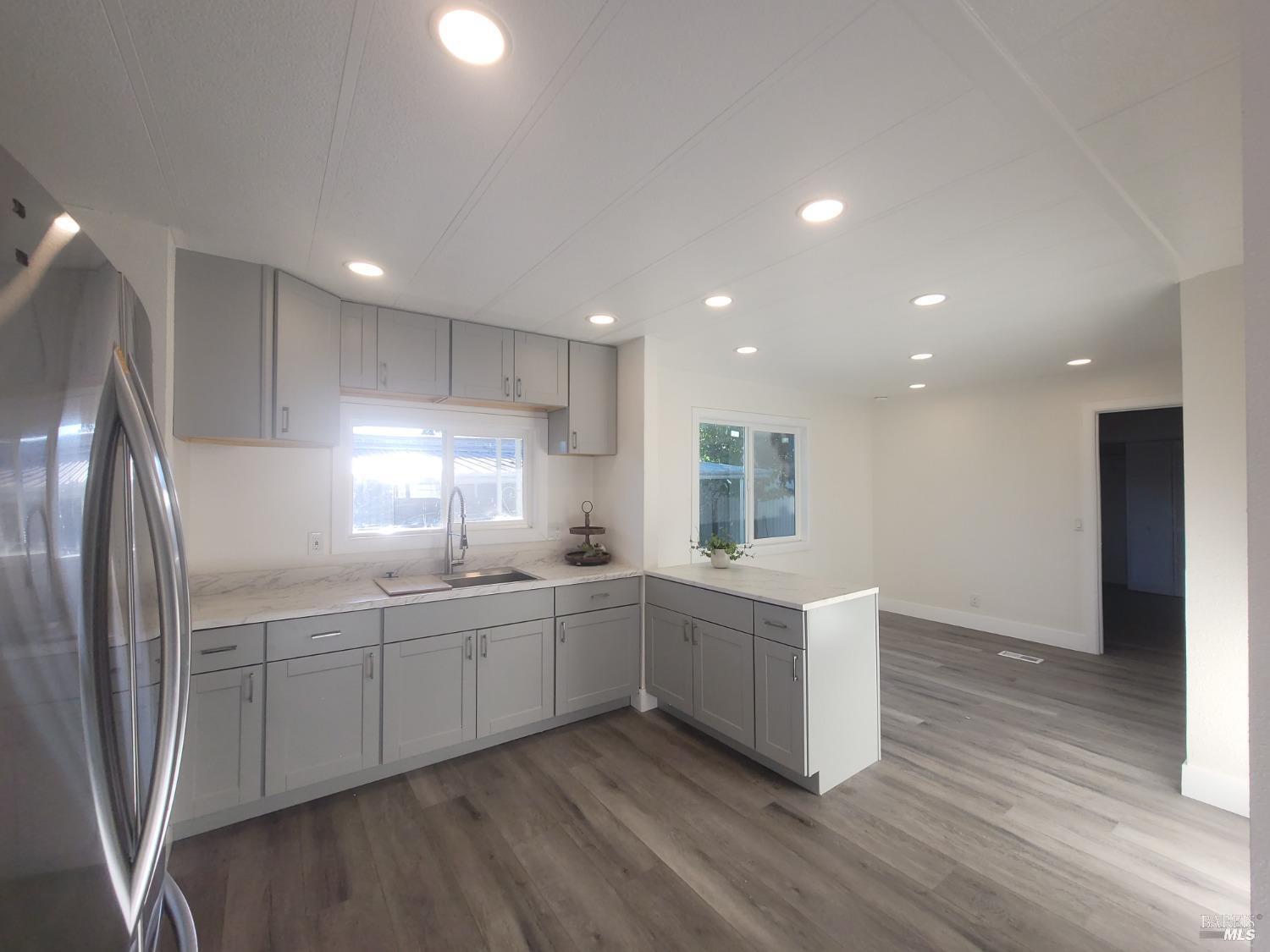 839 Nonie Street Santa Rosa, CA 95403 - Photo 7 of 23 a kitchen with counter top space sink and refrigerator