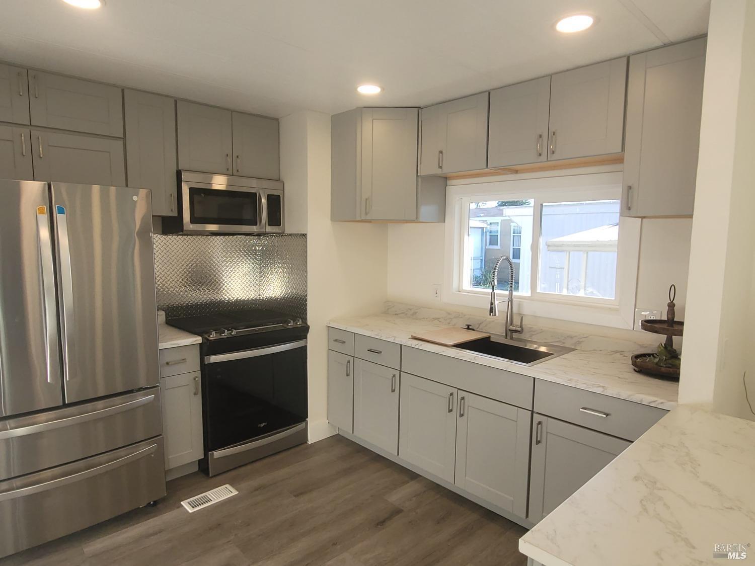 839 Nonie Street Santa Rosa, CA 95403 - Photo 9 of 23 a kitchen with a sink stainless steel appliances and cabinets