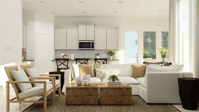 a living room with furniture a flat screen tv and a window