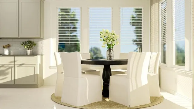 a dining room with furniture and window