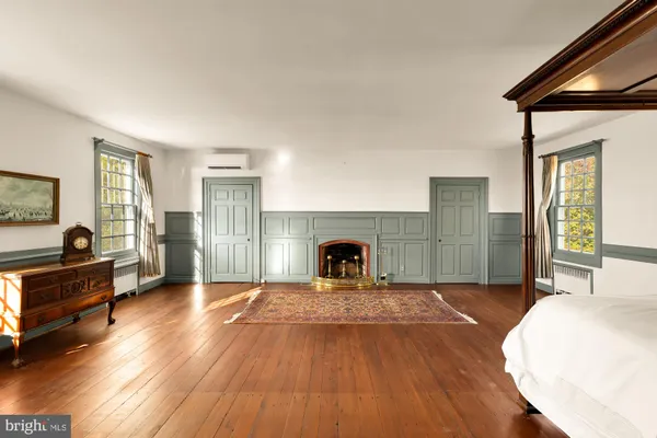 a bedroom with furniture and window