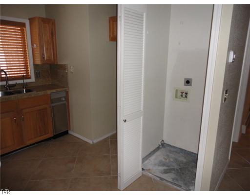 939 Incline Way, Unit 219 Incline Village, NV 89451 - Photo 8 of 12 Kitchen. washer and dryer area adjacent to kitchen