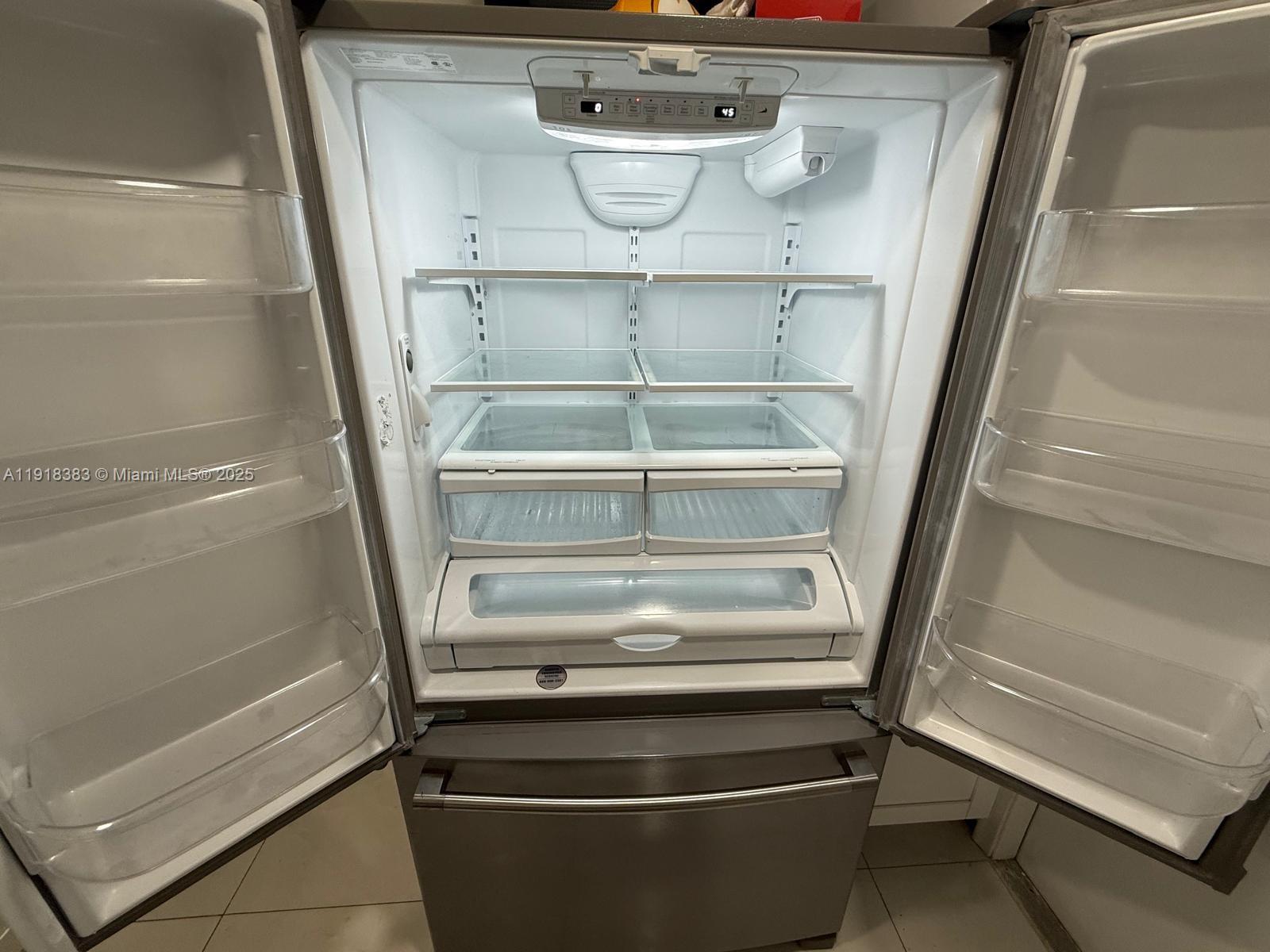 2461 Southwest 82nd Avenue, Unit 105 Davie, FL 33324 - Photo 11 of 17 a refrigerator in a kitchen