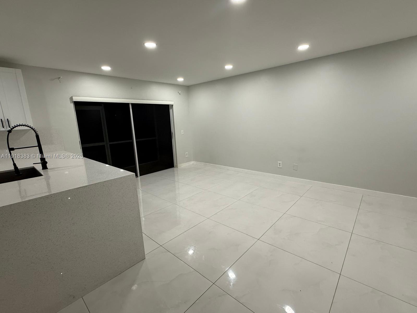 2461 Southwest 82nd Avenue, Unit 105 Davie, FL 33324 - Photo 15 of 17 a view of an empty room