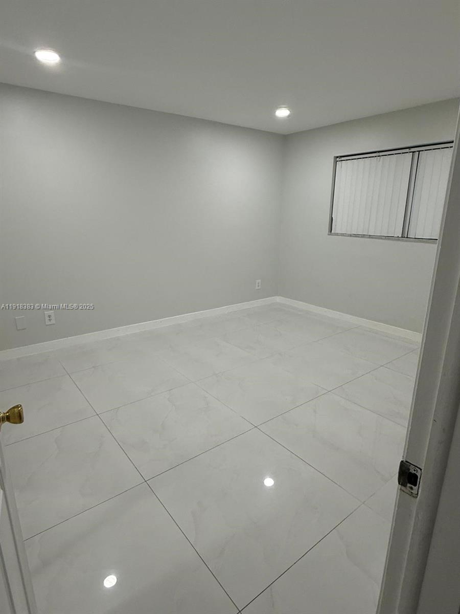 2461 Southwest 82nd Avenue, Unit 105 Davie, FL 33324 - Photo 9 of 17 a view of an empty room