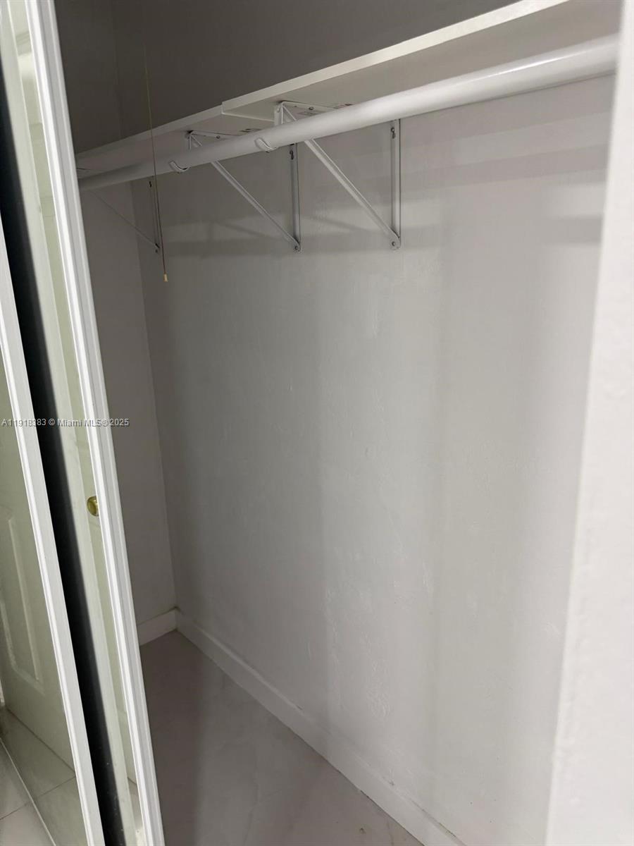 2461 Southwest 82nd Avenue, Unit 105 Davie, FL 33324 - Photo 10 of 17 a view of an empty walk in closet