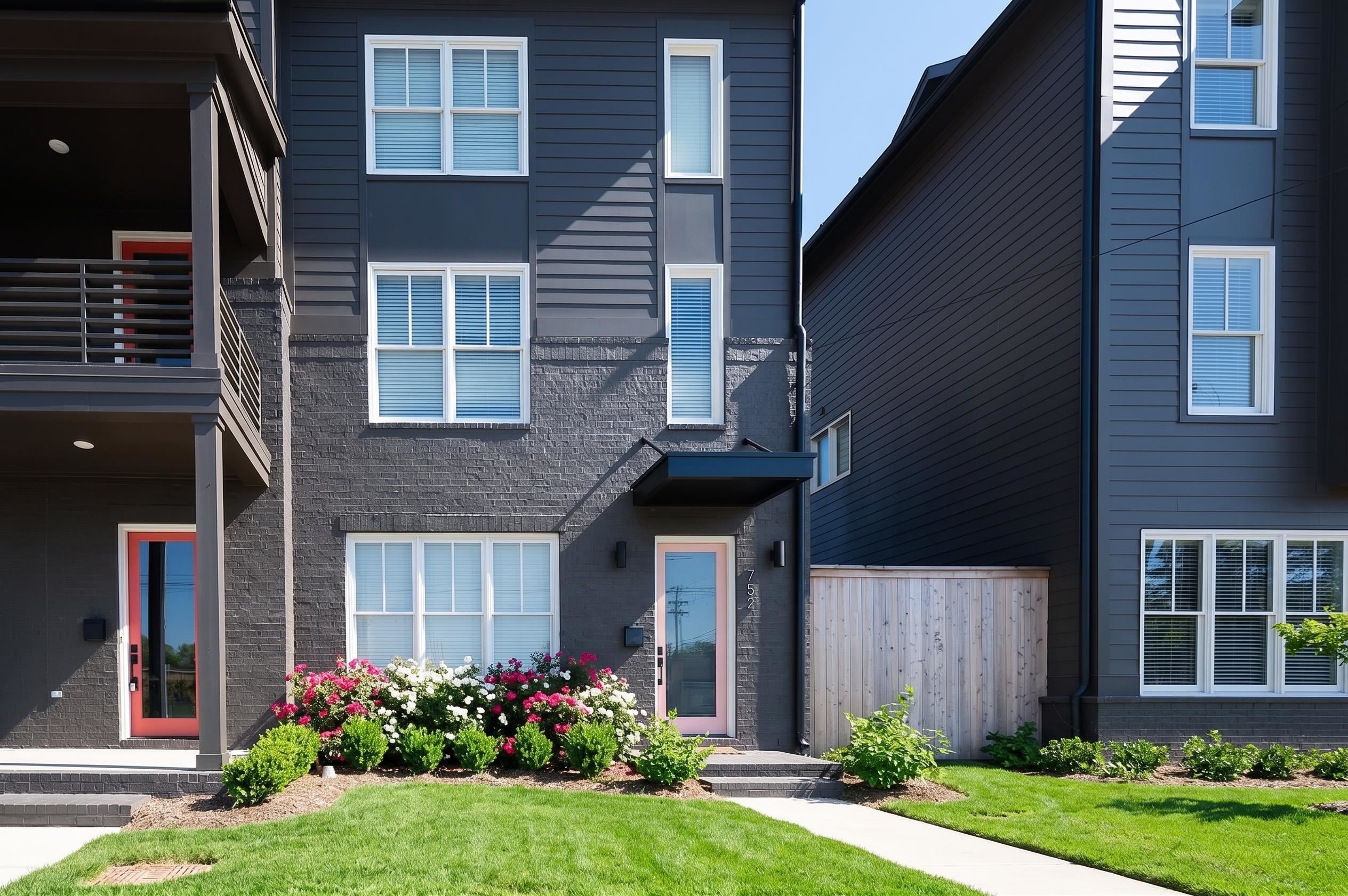 752 Meda Street Memphis, TN 38104 - Photo 1 of 18 Contemporary facade featuring dark gray siding and brick accents