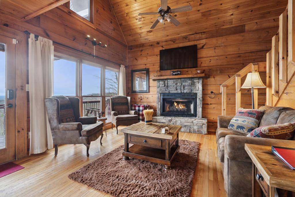 472 Timber Ridge Blue Ridge, GA 30513 - Photo 11 of 63 a living room with furniture fireplace and flat screen tv