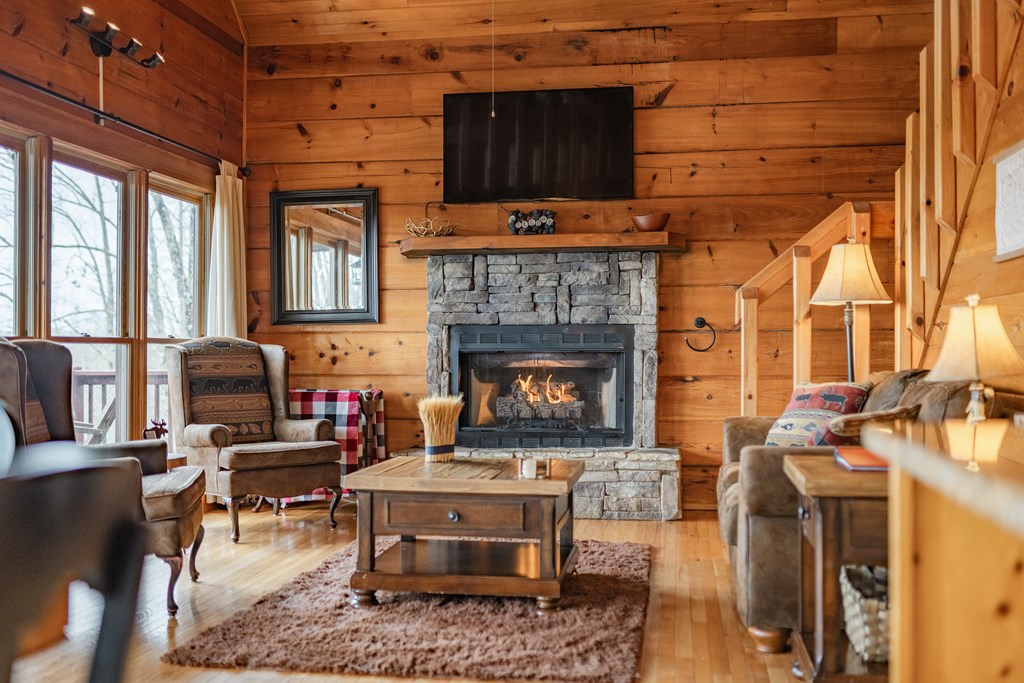 472 Timber Ridge Blue Ridge, GA 30513 - Photo 12 of 63 a living room with furniture a fireplace and a table