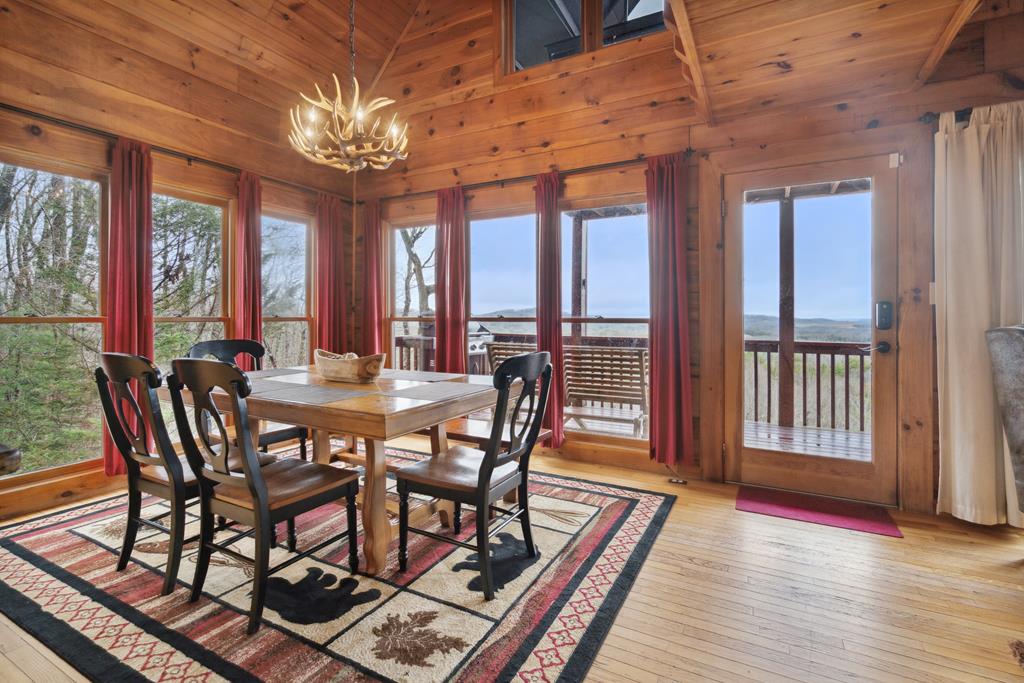 472 Timber Ridge Blue Ridge, GA 30513 - Photo 21 of 63 a view of a dining room with furniture wooden floor and chandelier