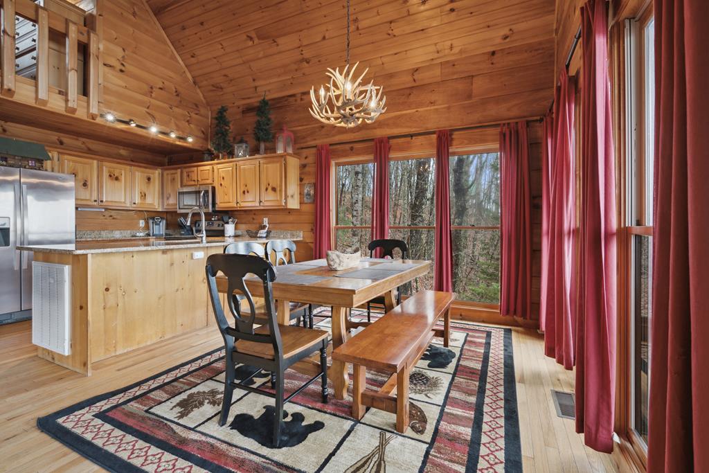 472 Timber Ridge Blue Ridge, GA 30513 - Photo 22 of 63 a view of a dining room with furniture window and wooden floor