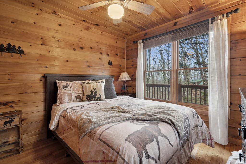 472 Timber Ridge Blue Ridge, GA 30513 - Photo 33 of 63 a bedroom with a bed and a large window
