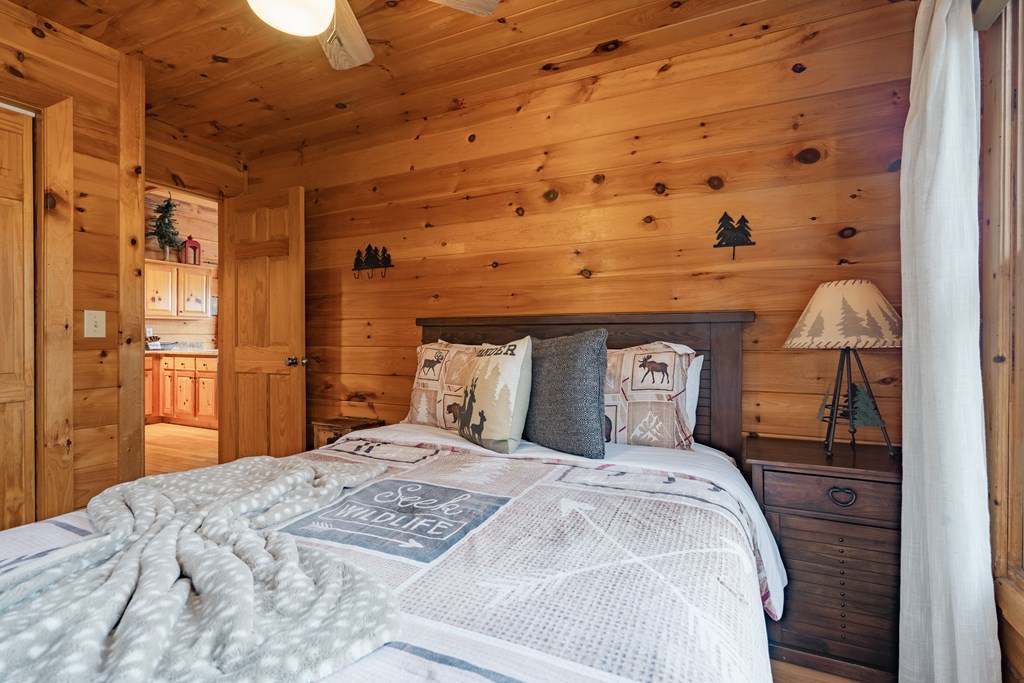 472 Timber Ridge Blue Ridge, GA 30513 - Photo 34 of 63 a bedroom with a bed and wooden floor