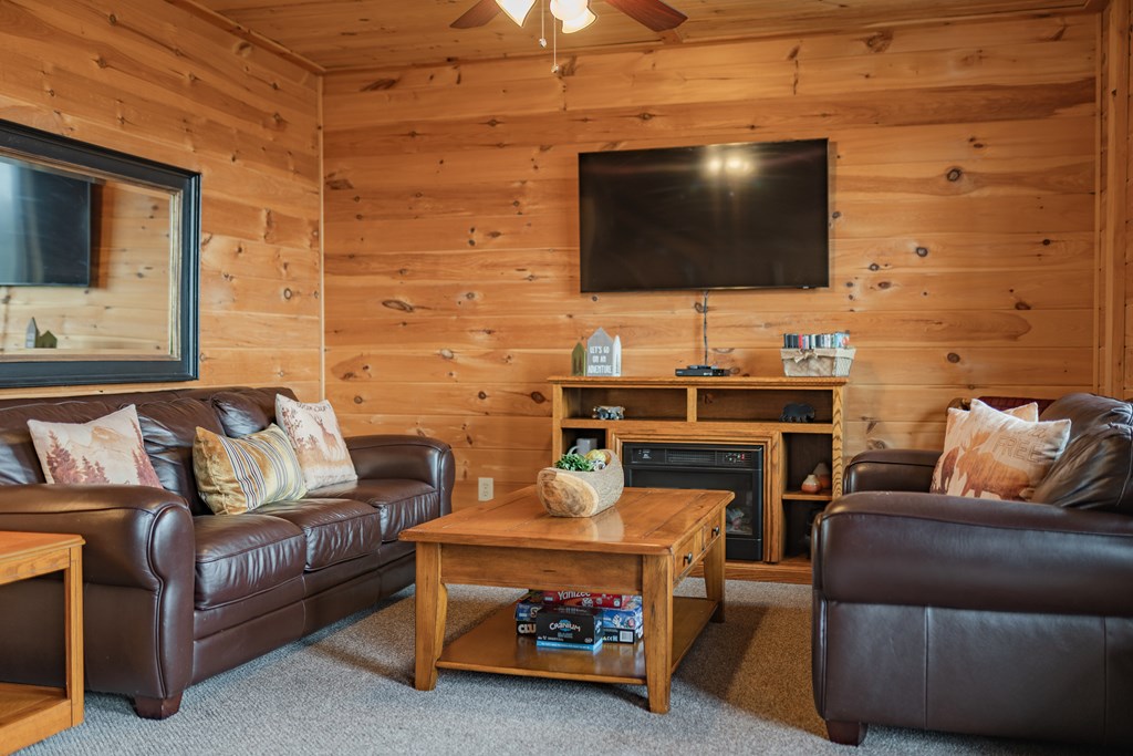 472 Timber Ridge Blue Ridge, GA 30513 - Photo 44 of 63 a living room with furniture and a flat screen tv