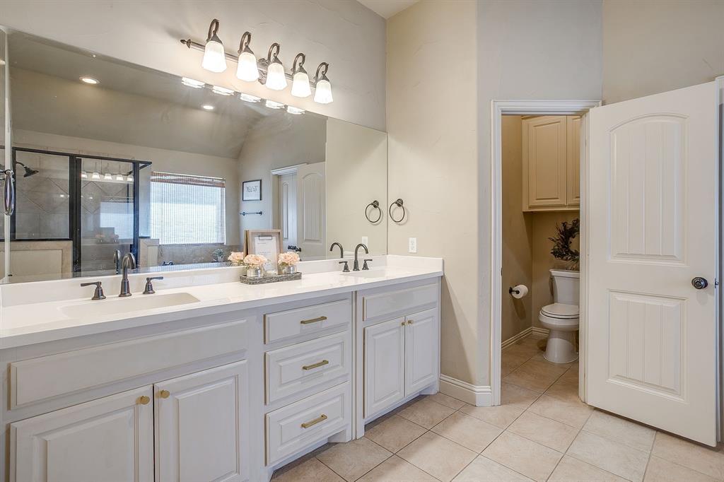 43 Crown Road Willow Park, TX 76087 - Photo 21 of 40 a bathroom with a double vanity sink and a mirror