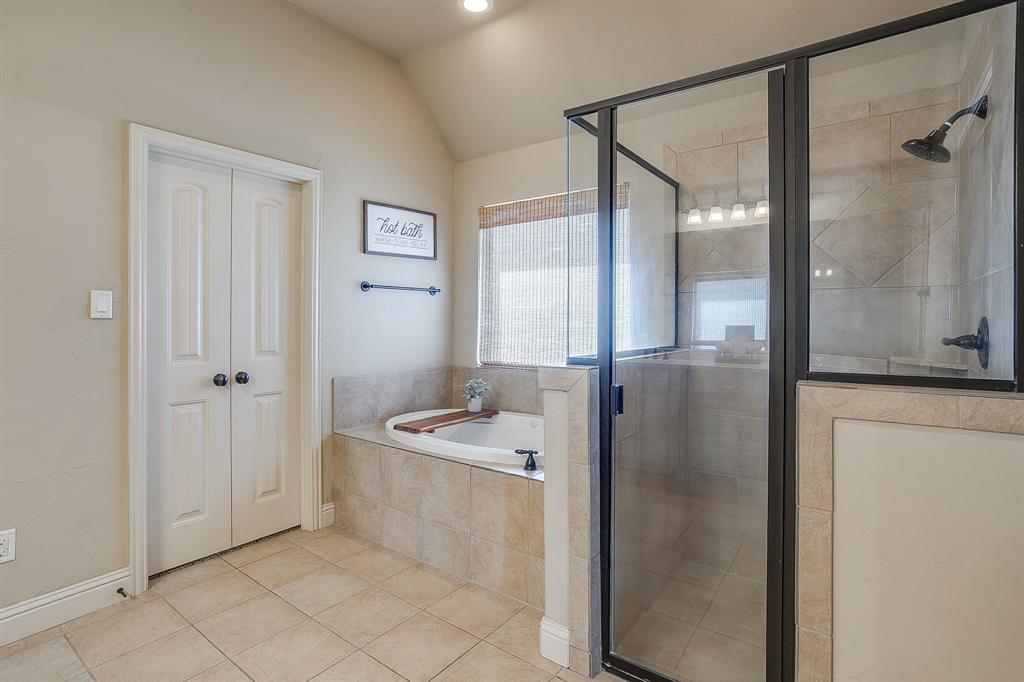 43 Crown Road Willow Park, TX 76087 - Photo 22 of 40 a bathroom with a bathtub and a shower