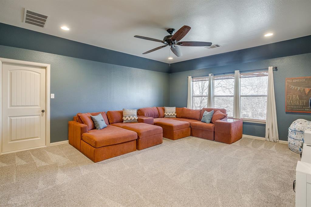 43 Crown Road Willow Park, TX 76087 - Photo 26 of 40 a living room with furniture ceiling fan and a window