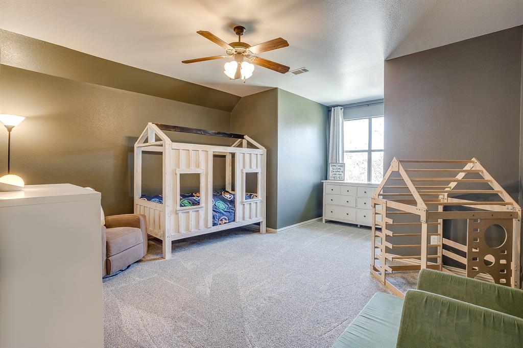 43 Crown Road Willow Park, TX 76087 - Photo 29 of 40 a living room with furniture and a chandelier
