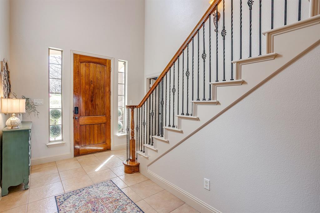 43 Crown Road Willow Park, TX 76087 - Photo 4 of 40 a view of staircase with wooden floor and a rug