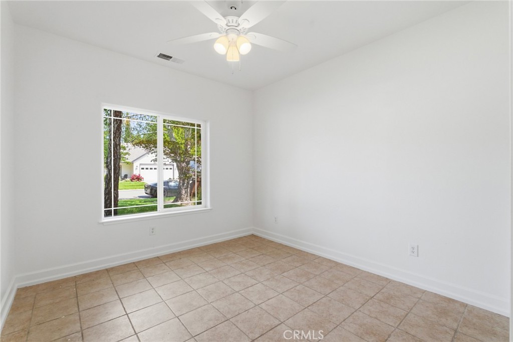 451 Hideaway Chico, CA 95926 - Photo 27 of 33 an empty room with windows and fan