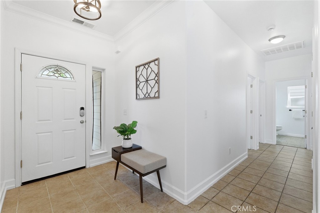 451 Hideaway Chico, CA 95926 - Photo 10 of 33 a view of a hallway with wooden floor and a potted plant