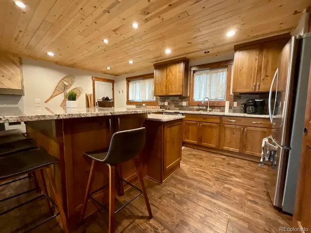 a kitchen with lots of counter top space and appliances