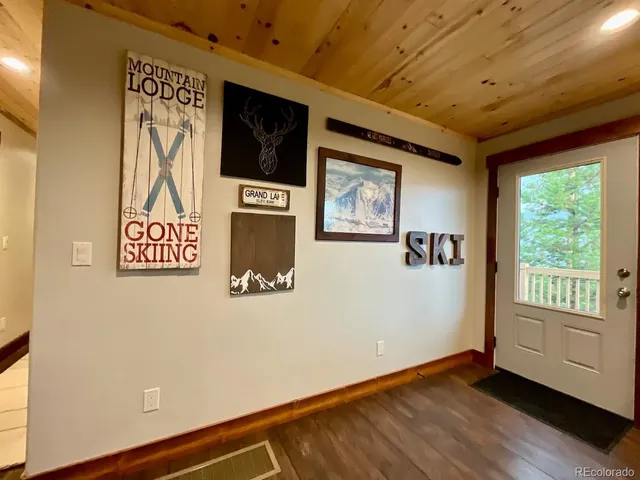 a view of a livingroom with wooden floor