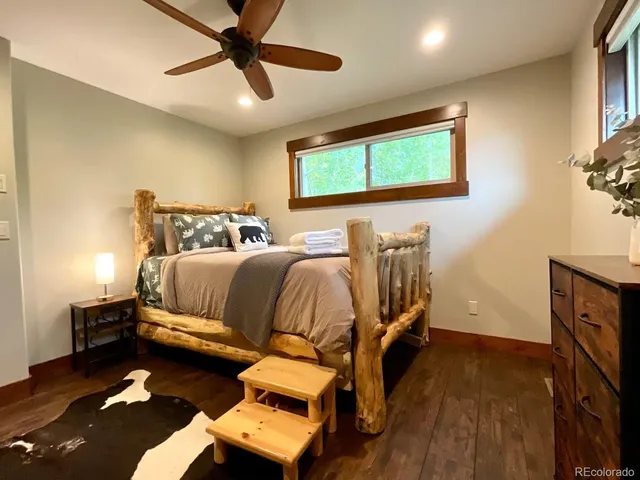 a bedroom with bed and window