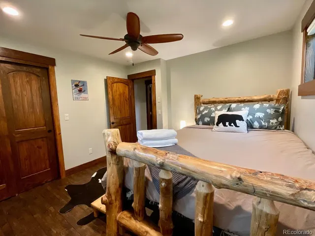 a bedroom with furniture and wooden floor