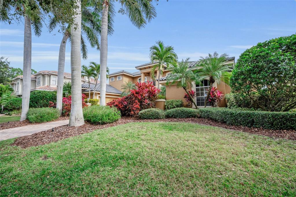 8871 Silverthorn Road Seminole, FL 33777 - Photo 12 of 98 a front view of a house with garden