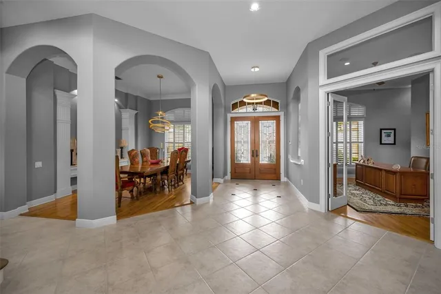 a kitchen with stainless steel appliances kitchen island granite countertop a refrigerator and a stove top oven