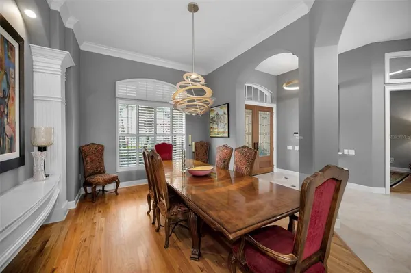 a kitchen with kitchen island granite countertop a sink counter top space appliances and a window