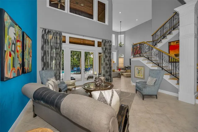 a view of a livingroom with workspace and a window