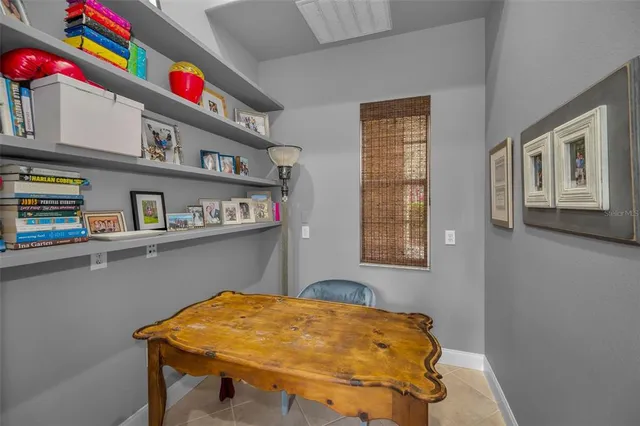 a spacious bedroom with a bed and a ceiling fan