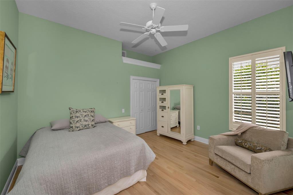 8871 Silverthorn Road Seminole, FL 33777 - Photo 47 of 98 a bedroom with a bed and furniture