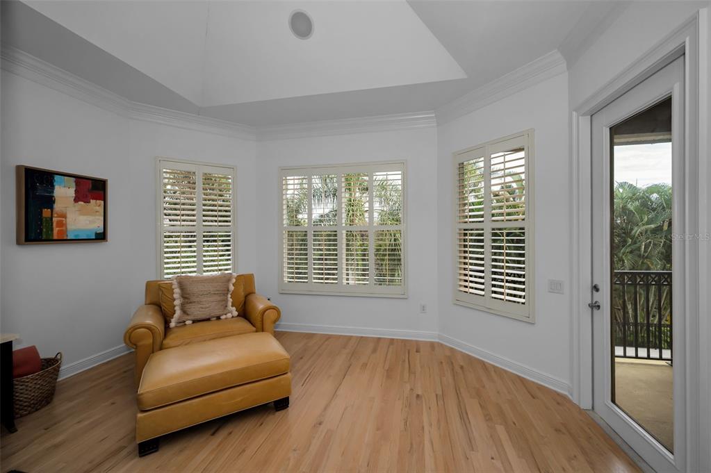 8871 Silverthorn Road Seminole, FL 33777 - Photo 58 of 98 a bedroom with a bed and wooden floor