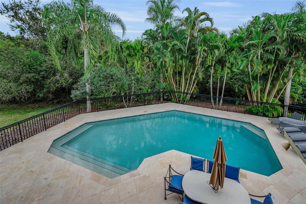 8871 Silverthorn Road Seminole, FL 33777 - Photo 61 of 98 a view of a swimming pool with a patio