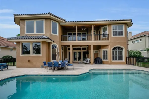 an aerial view of a house with outdoor space and lake view