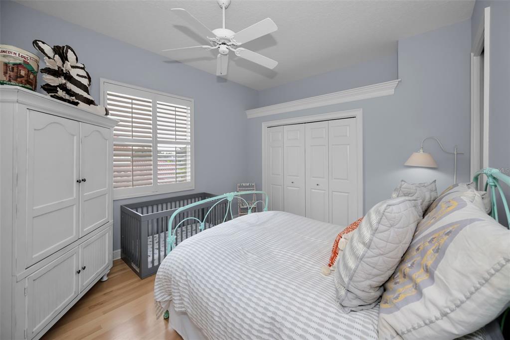 8871 Silverthorn Road Seminole, FL 33777 - Photo 74 of 98 a bedroom with a large bed and a window