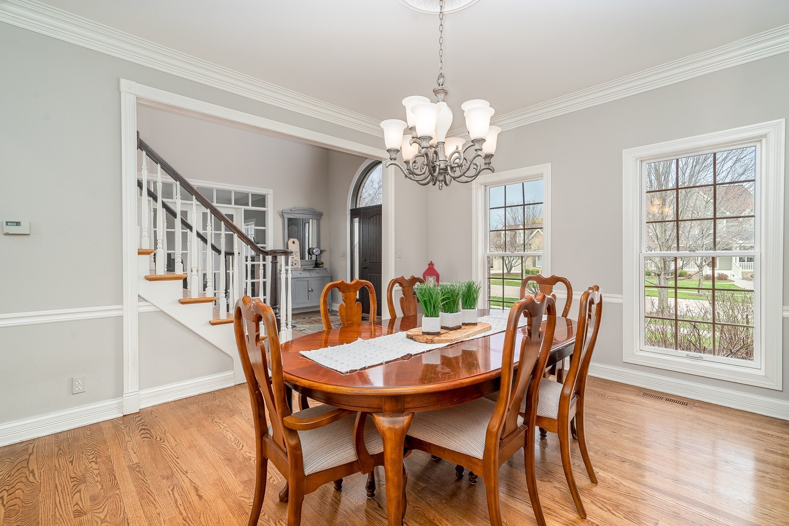 Undisclosed Address Geneva, IL 60134 - Photo 11 of 29 a view of a dining room with furniture window and wooden floor