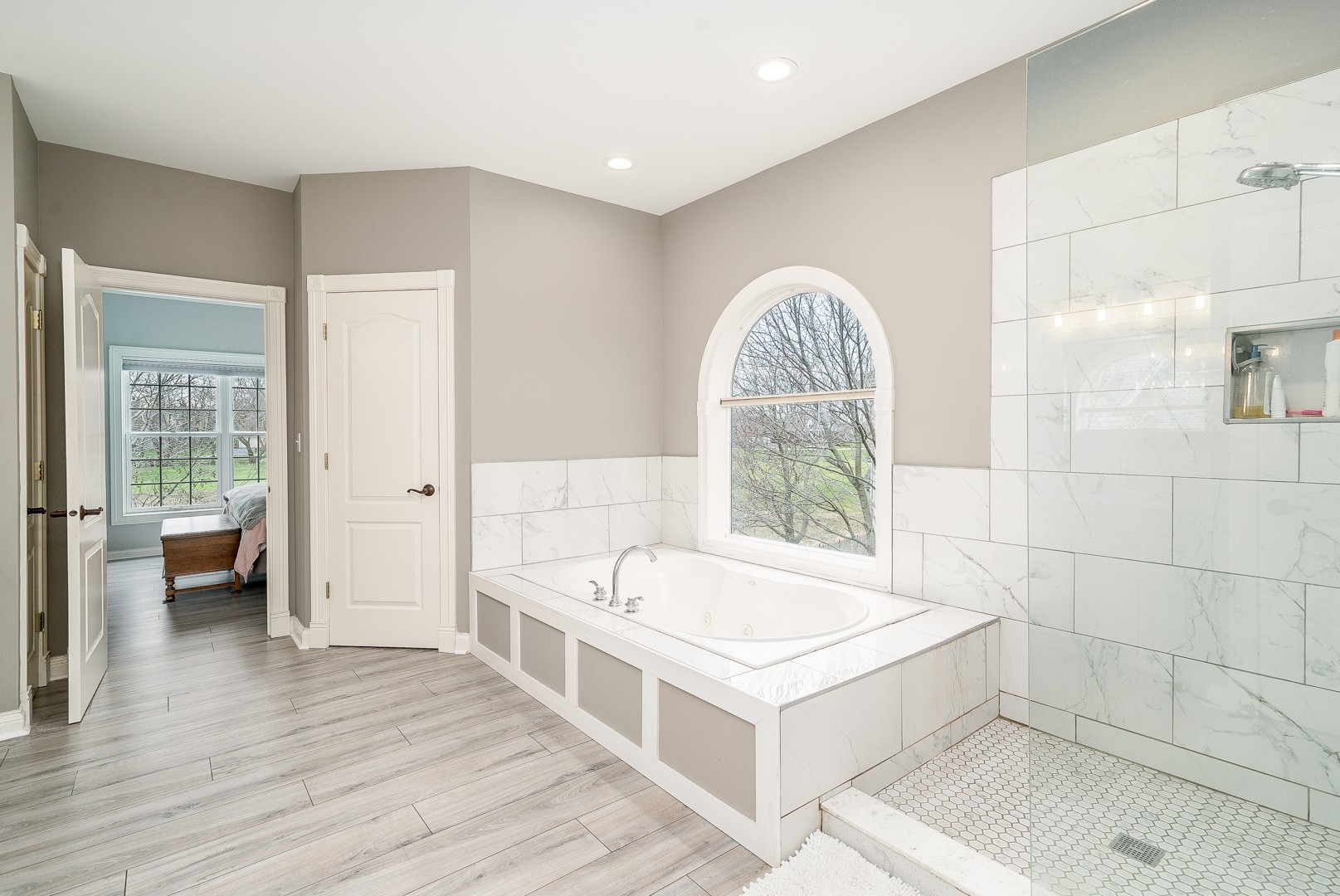 Undisclosed Address Geneva, IL 60134 - Photo 17 of 29 a bathroom with a tub a sink and a large window