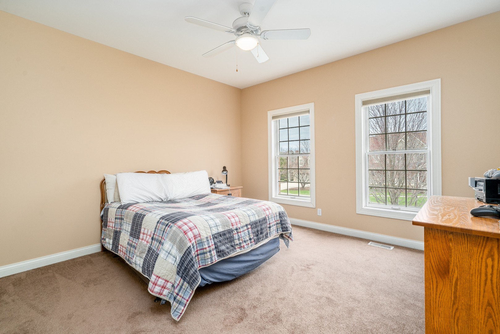 Undisclosed Address Geneva, IL 60134 - Photo 24 of 29 a bed sitting in a spacious bedroom next to a window