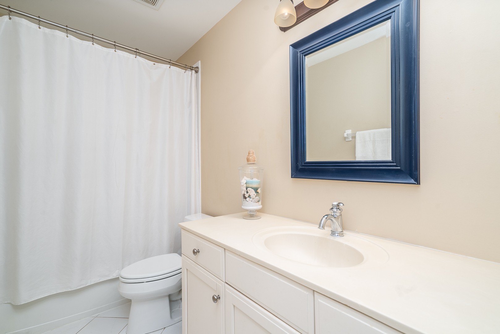 Undisclosed Address Geneva, IL 60134 - Photo 25 of 29 a bathroom with a toilet a sink and a mirror