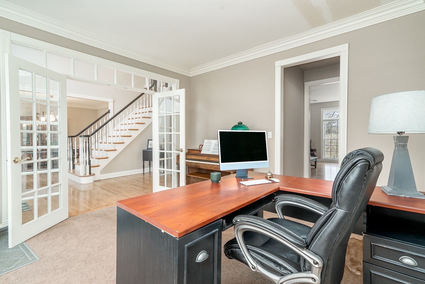 Undisclosed Address Geneva, IL 60134 - Photo 3 of 29 a view of a workspace with furniture and wooden floor