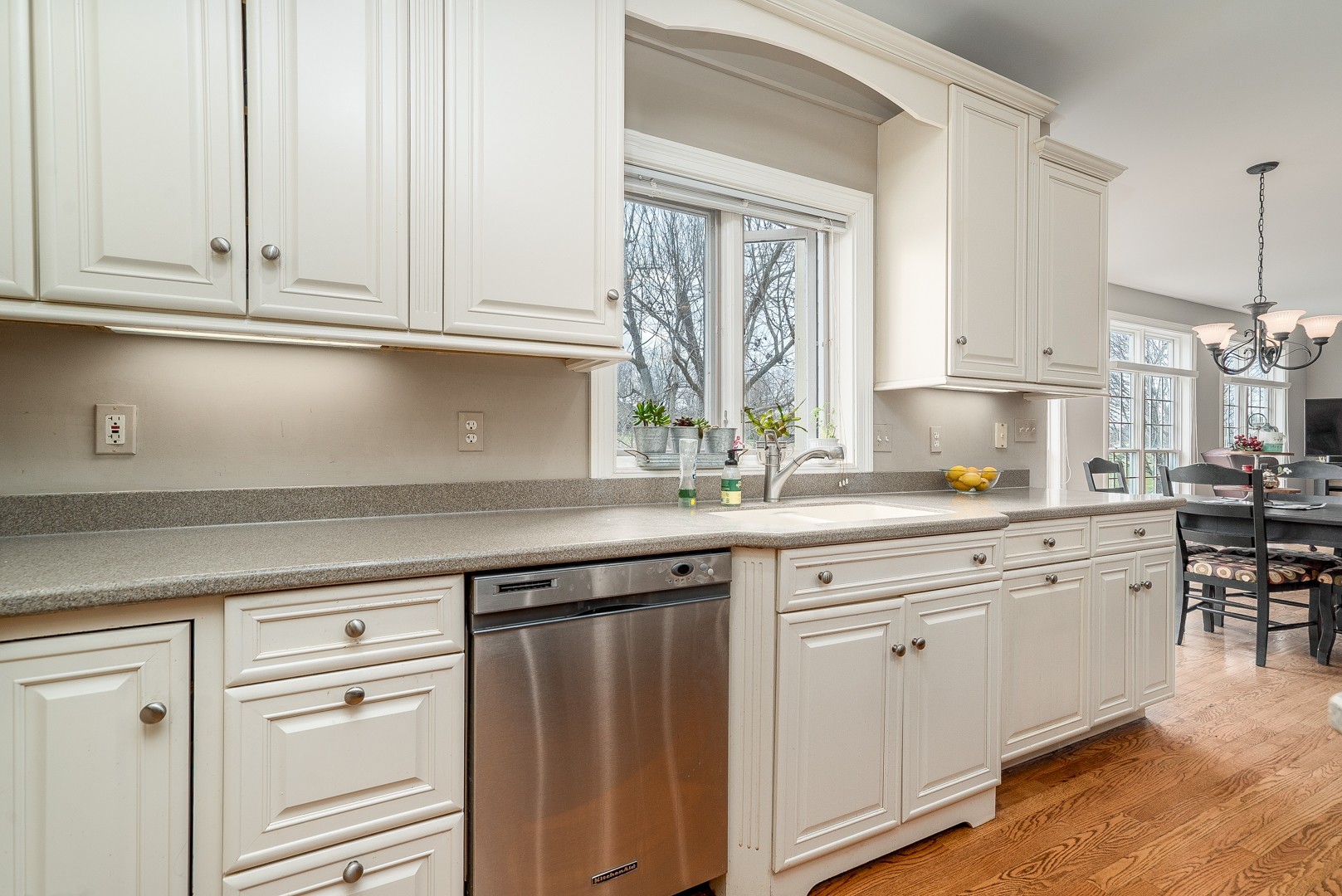 Undisclosed Address Geneva, IL 60134 - Photo 9 of 29 a kitchen with granite countertop white cabinets and white appliances