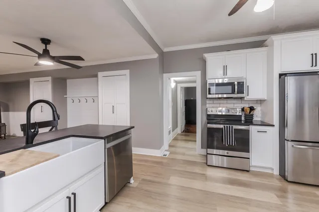 a view of a dining room with furniture and wooden floor